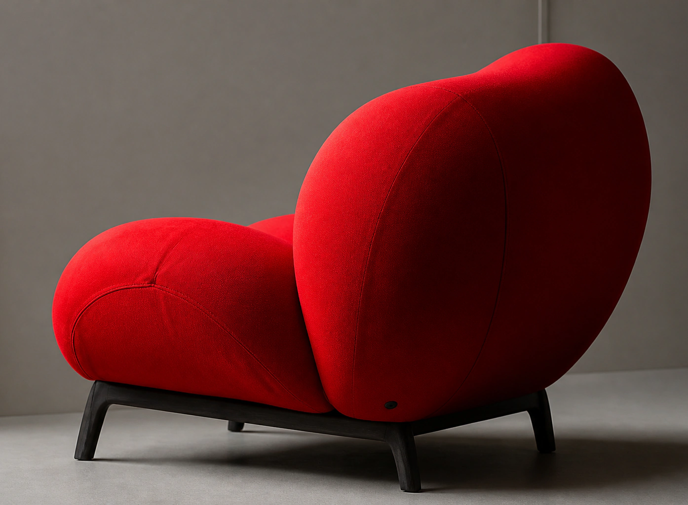 Red sculptural lounge chair from the 2026 collection