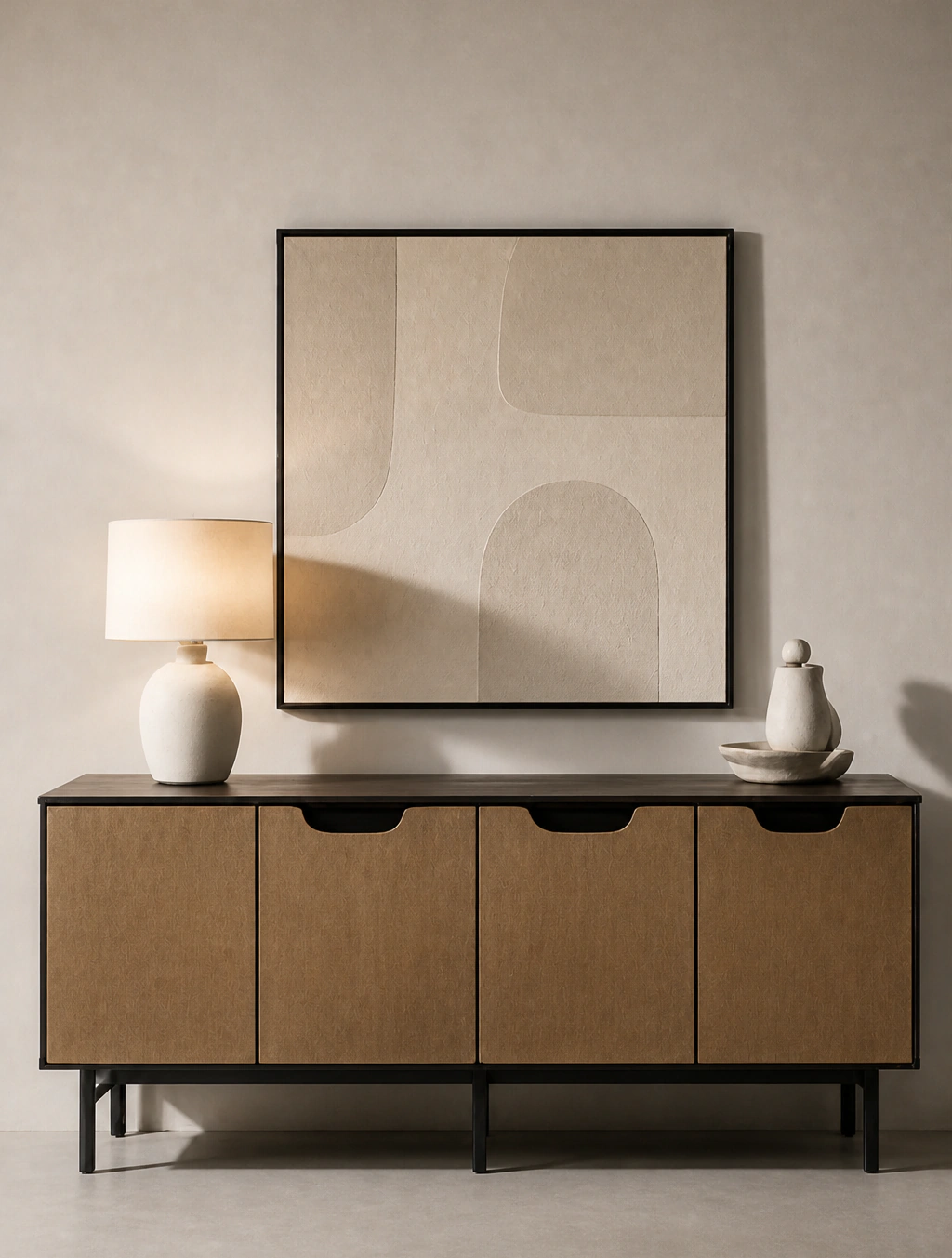 Sideboard with a table lamp and framed print