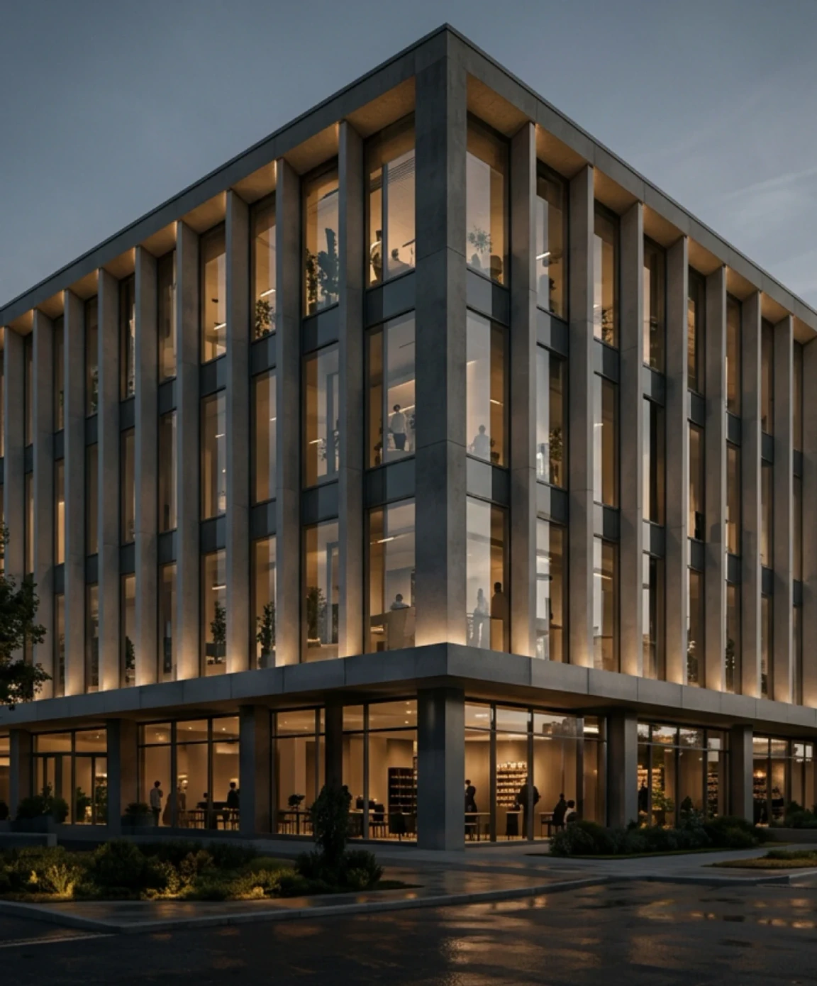 Colonnaded office building lit from within at evening