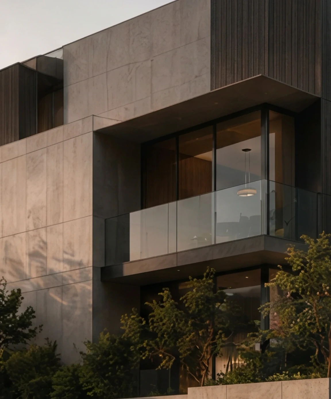 Stone-clad facade with a cantilevered balcony